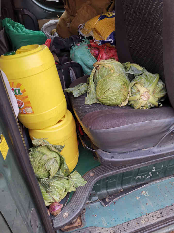 2 cans of cooking oil in good neighbourhood with the cabbage